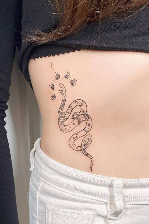 dagger and snake tattoo in ribs