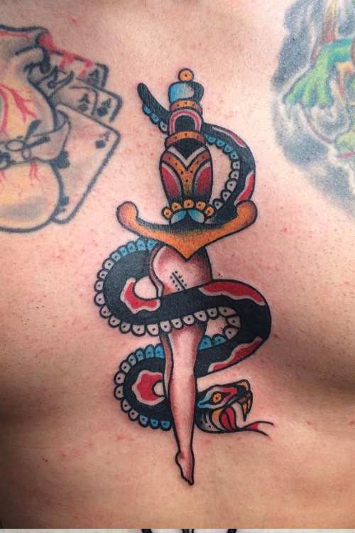 dagger and snake tattoo in chest